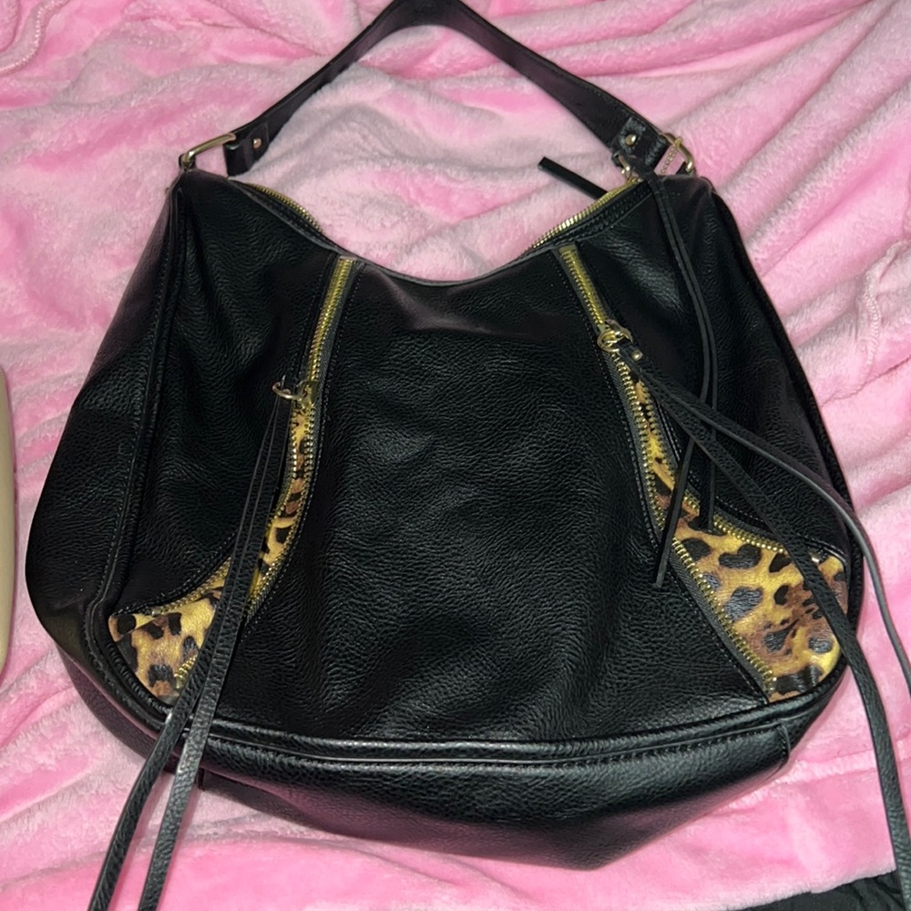 Beautiful black & cheetah leather bag. Never used. Great condition.